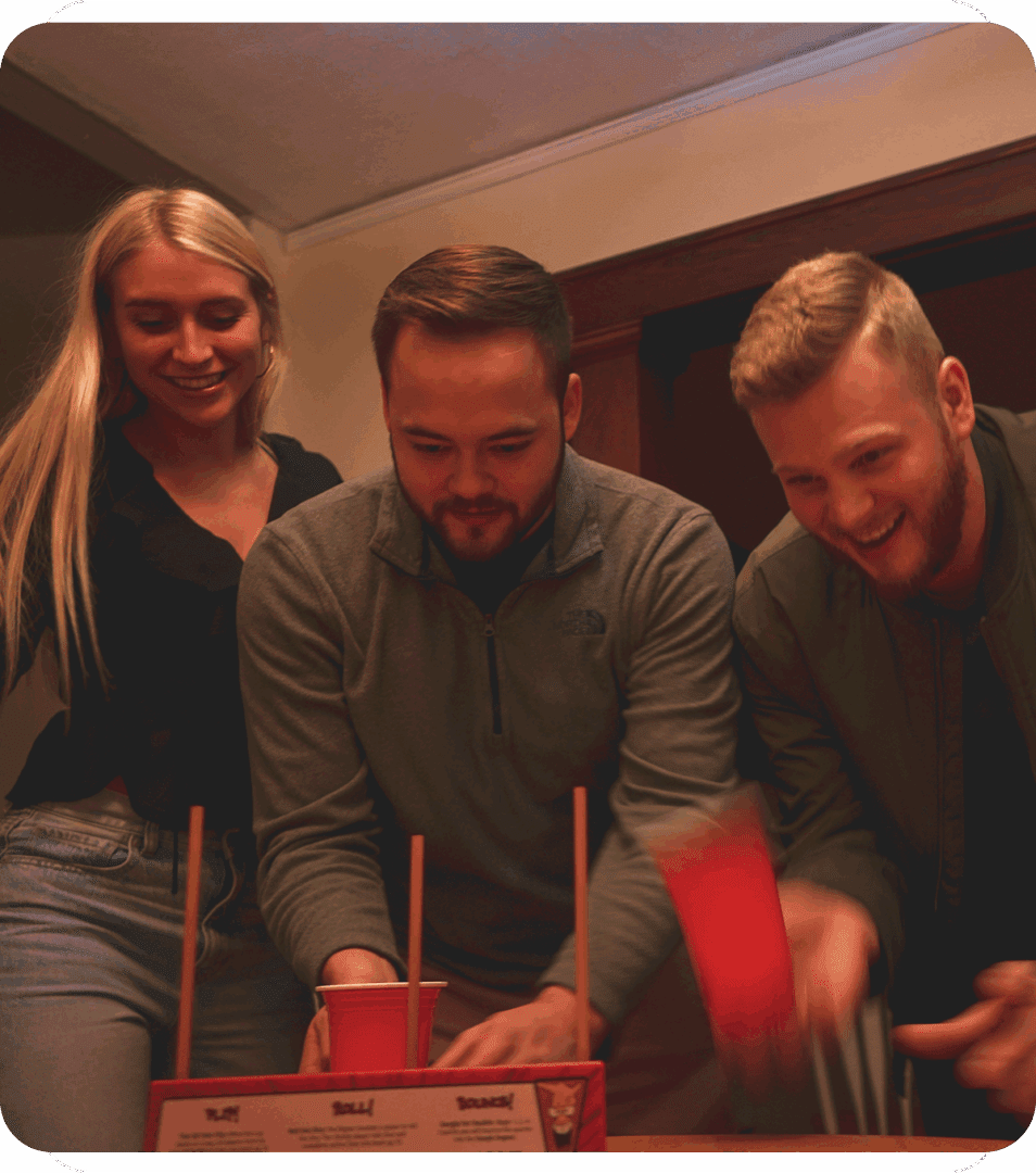 Friends playing a fun tabletop game together.